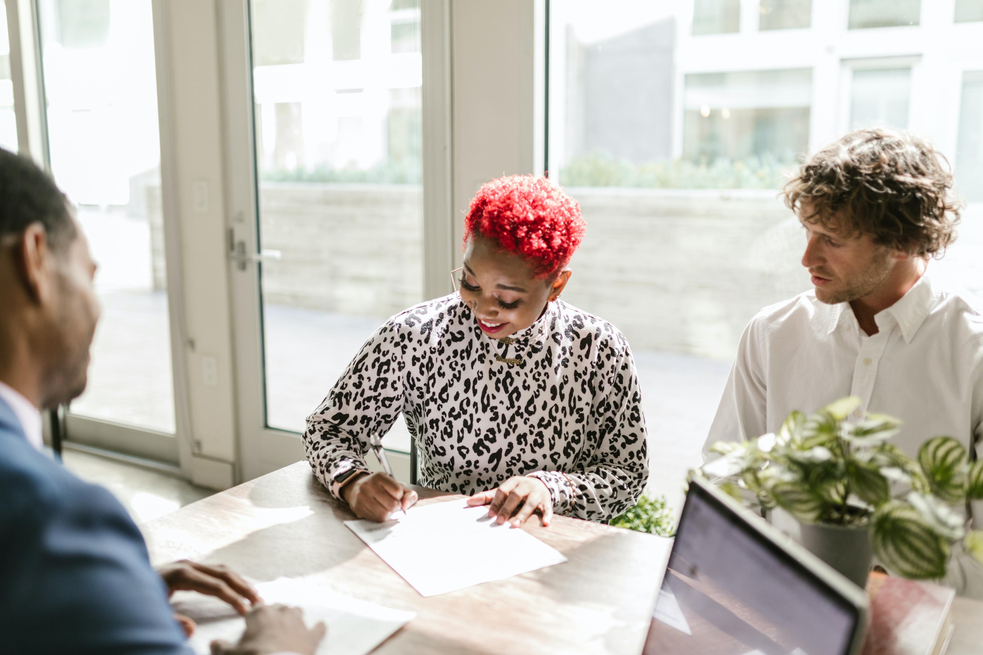 First time homebuyer signing a mortgage contract